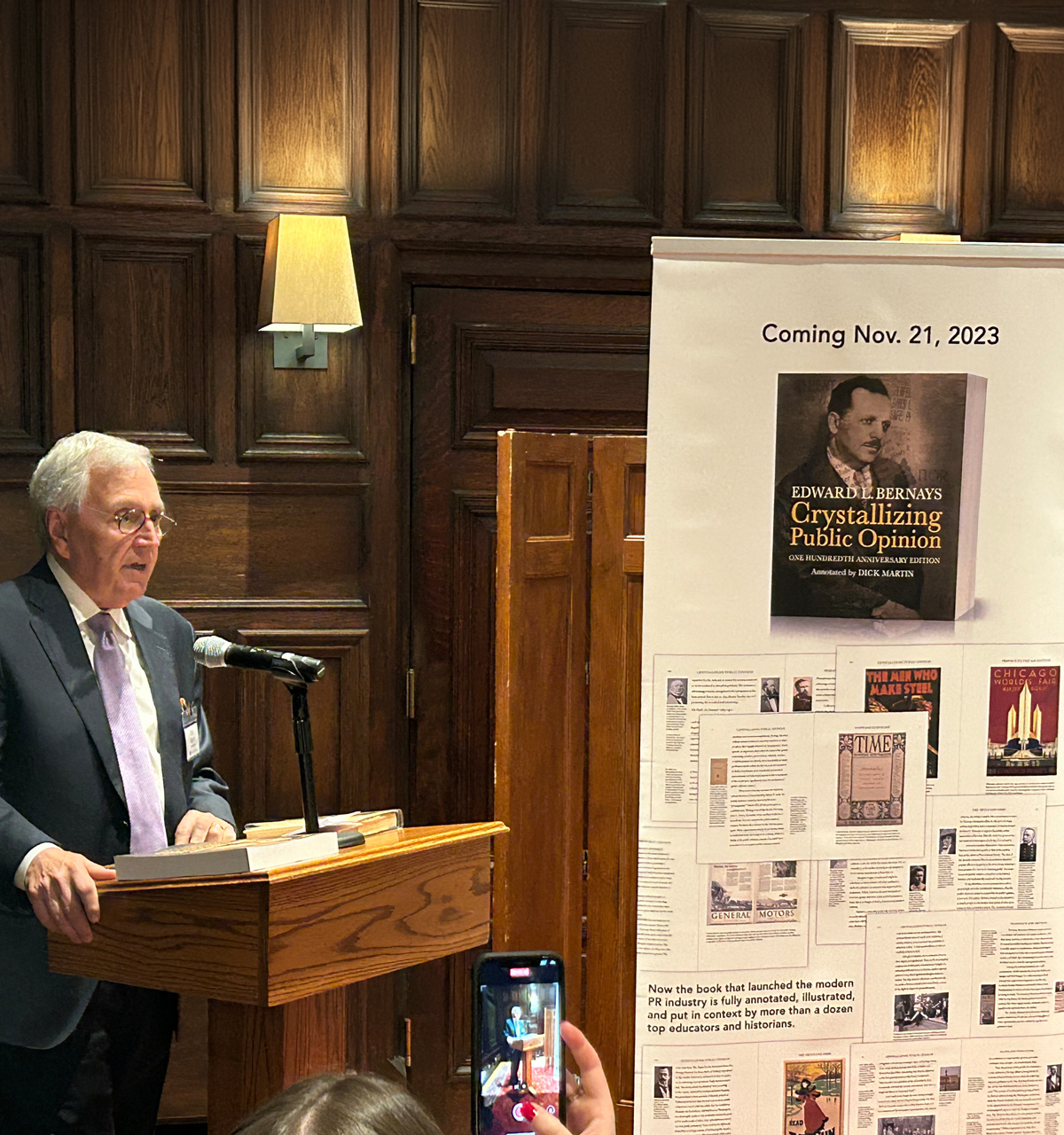 A keynote speakers provides remarks during a book release party for the annotated version of the first public relations